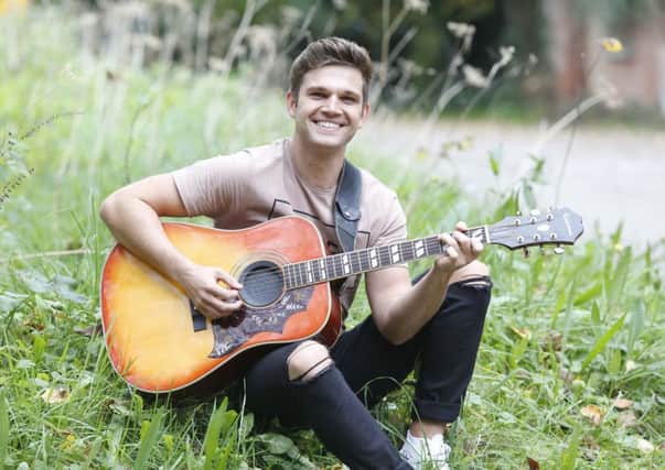 Unsigned artist Tom Bertram found himself alongside Miley Cyrus and Demi Lovato in the charts 


Picture: Habibur Rahman