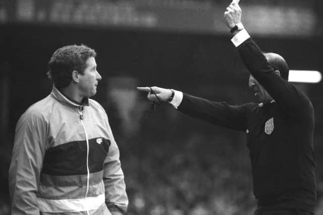 Pompey boss Alan Ball gets a booking from referee John Key after complaining about the sending off of his striker, Mike Quinn, during the 1988 FA Cup match quarter-final against Luton Town