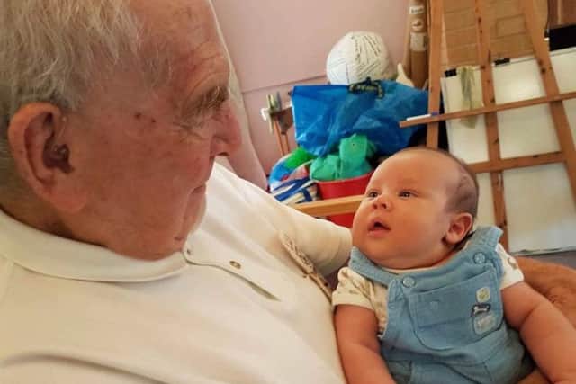 Barrie Taylor with baby Elijah Snuggs at Lockswood Day Centre in Locks Heath     Credit - Mandy Rowlands