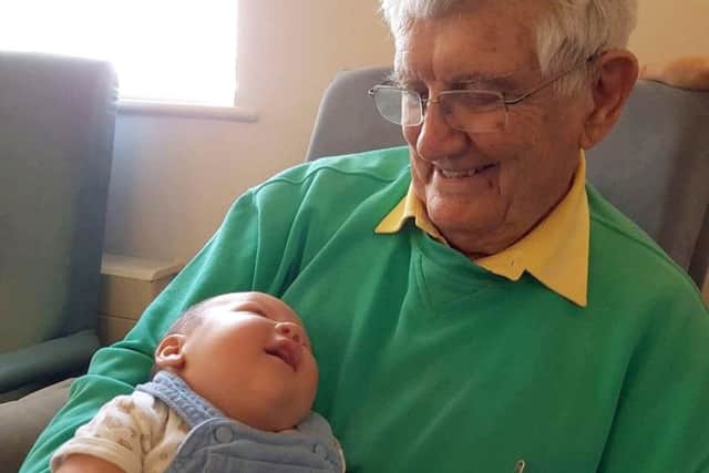 Gordon Faucon with baby Elijah Snuggs at Lockswood Day Centre in Locks Heath Picture: Mandy Rowlands