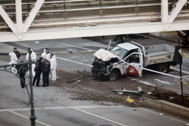 A damaged Home Depot truck after a motorist drove onto a bike path near the World Trade Center memorial killing eight (AP Photo/Bebeto Matthews) dc76fc45-d9f1-4ca9-81bd-212ea555