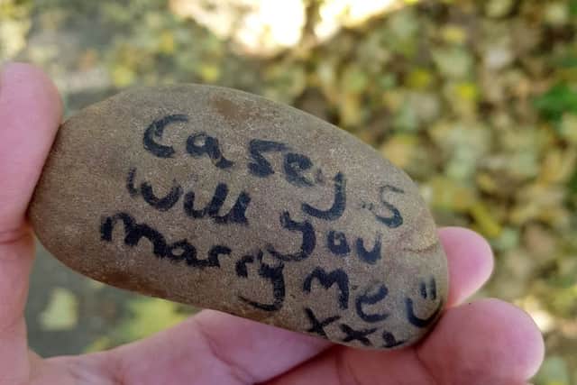 Casey Smith's proposal written on a stone