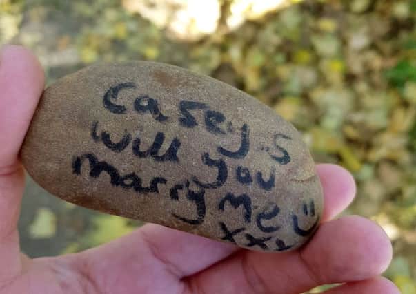 Casey Smith's proposal written on a stone
