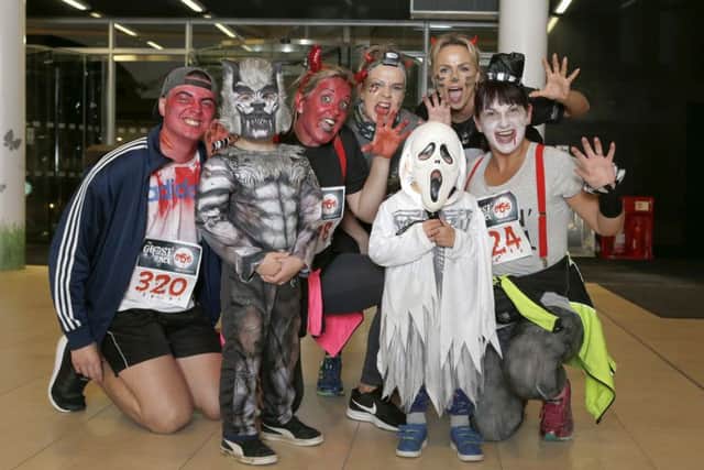 Children and adults dressed up for the race