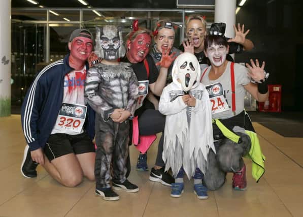 Children and adults dressed up for the race