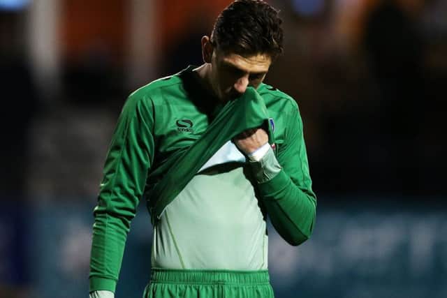 Pompey keeper Luke McGee shows his disappointment at the final whistle Picture: Joe Pepler