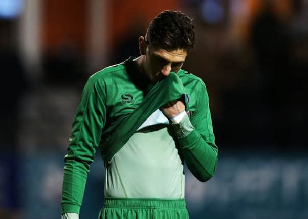 Pompey keeper Luke McGee shows his disappointment at the final whistle Picture: Joe Pepler