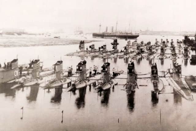 A gaggle of 33-submarines tied up at HMS Dolphin, Gosport, pre-January 1922. HMS Victory is in the far distance.