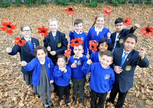 Children from Arundel Court Primary Academy with some of the poppies