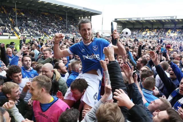 Christian Burgess celebrates Pompey's promotion at Notts County. Picture: Joe Pepler