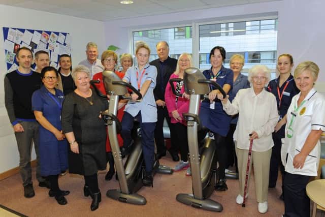 Jack Bullen's widow Lorraine, and family with QA staff and the exercise bikes
Picture: Malcolm Wells (171103-7859)