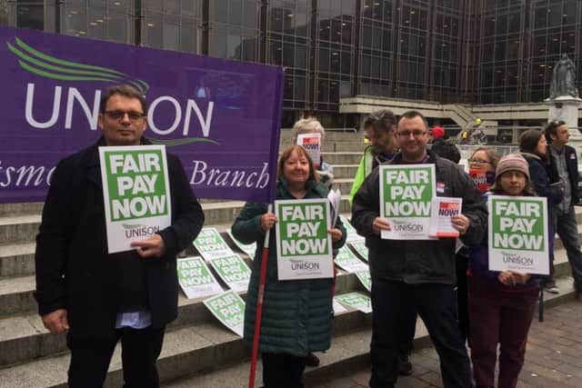 A protest about pay was held outside Portsmouth Guildhall by union members