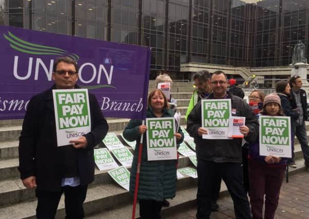 A protest about pay was held outside Portsmouth Guildhall 
by union members
