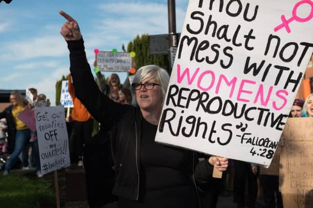 A pro-choice campaigner demonstrates against the pro-life protest at St Mary's last month Picture: Vernon Nash