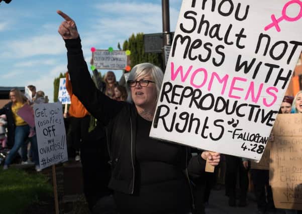 A pro-choice campaigner demonstrates against the pro-life protest at St Mary's last month Picture: Vernon Nash