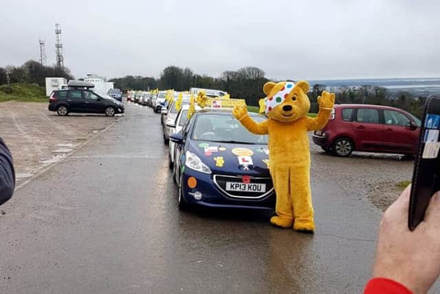 A convoy of driving instructors prepares to embark from Portsdown Hill on the Portsmouth leg of the Big Learner Relay, led by Nick Pink 
Picture: Jane Holt
