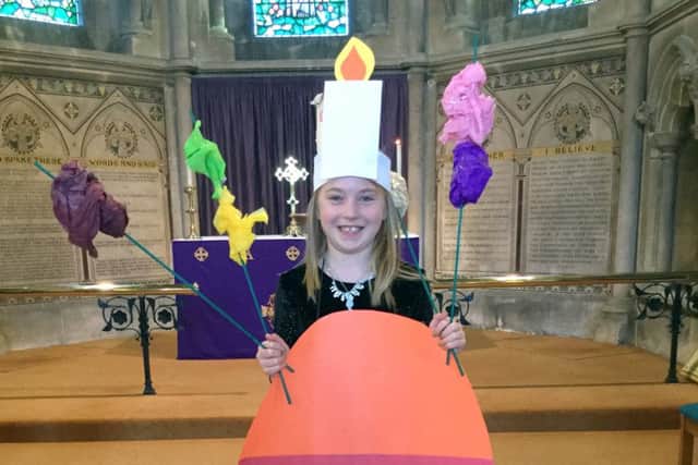Seven-year-old Beatrice Hughes dressed as a Christingle at St Mary's Church, Hook-with-Warsash