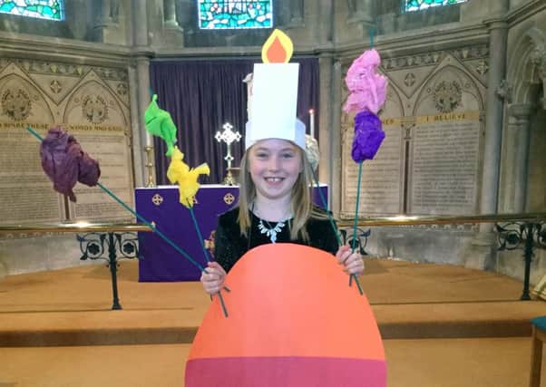 Seven-year-old Beatrice Hughes dressed as a Christingle at St Mary's Church, Hook-with-Warsash