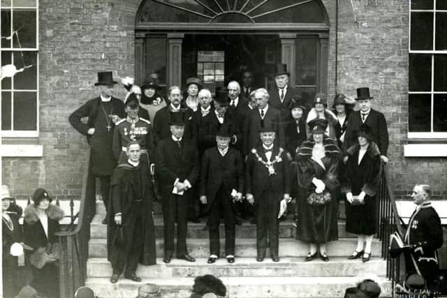 Opening of the new school by the home secretary in October 1927. The headmaster, Canon Barton, is on the lowest step, on the left. Dorothea Barton is possibly there, somewhere. (PGS Archive)