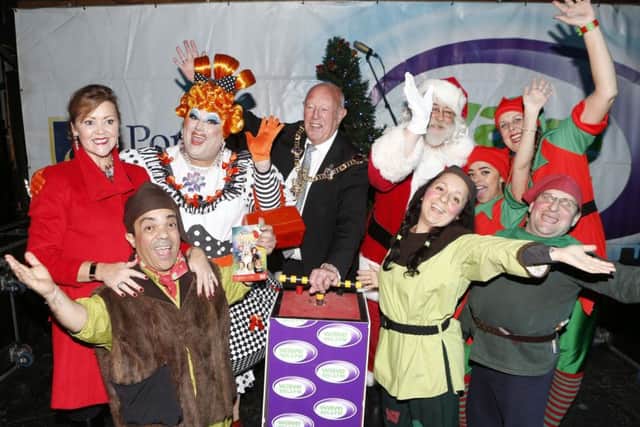The Lord Mayor of Portsmouth, cllr  Ken Ellcome with his wife, Jo and the Christmas panto cast of Snow White switch on the Christmas lights    Pictures: Habibur Rahman