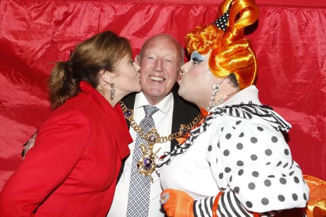 The Lord Mayor of Portsmouth, cllr Ken Ellcome, gets a kiss from his wife,  Jo, and panto dame Jack Edwards