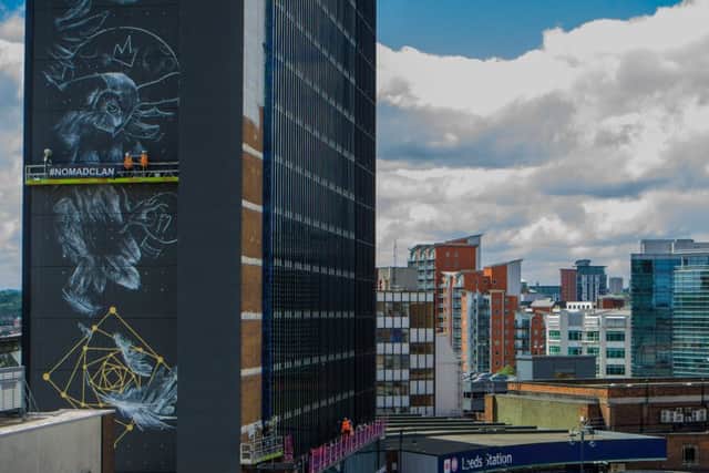 Nomad Clan working on Athena Rising on the side of the Platform Building near Leeds Station, on June 15, 2017.Picture by James Hardisty