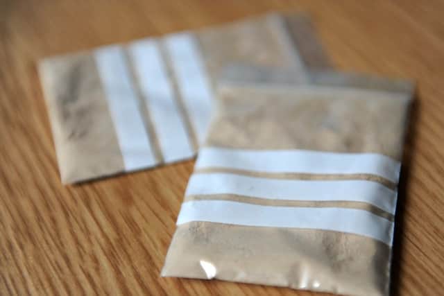 File photos of bags of heroin
