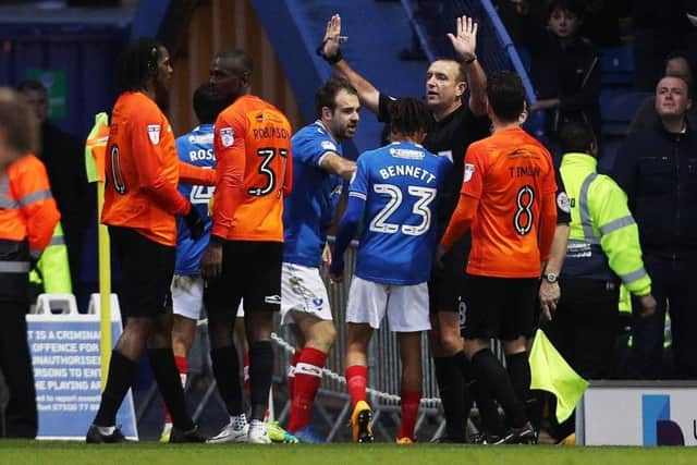 Carl Boyeson under pressure at Fratton Park. Picture: Joe Pepler