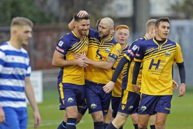 Lee Molyneaux congratulates fellow new signing Jamie Thompson on his goal. Picture: Ian Hargreaves (171572-1)