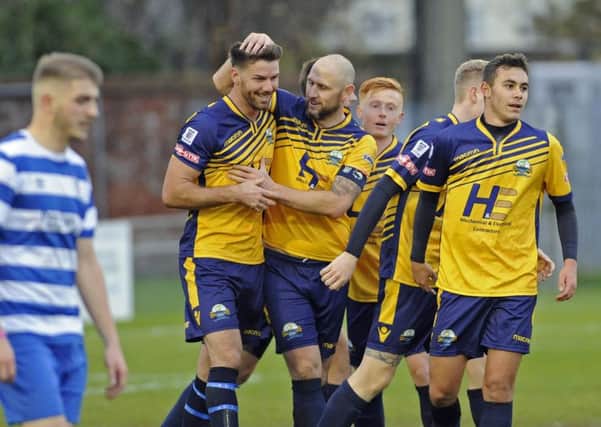 Lee Molyneaux congratulates fellow new signing Jamie Thompson on his goal. Picture: Ian Hargreaves (171572-1)