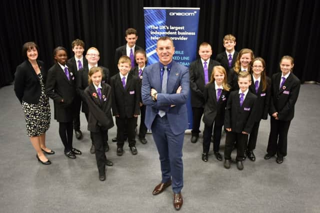 Onecom CEO Darren Ridge and principal Helen Cassidy with pupils of Havant Academy