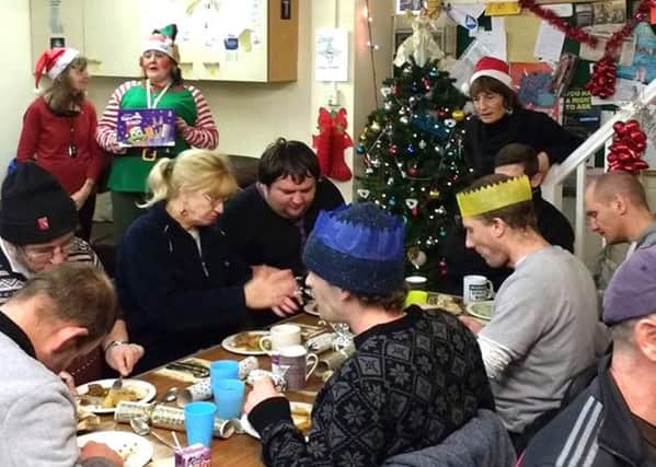 Volunteers and service users at a special Christmas meal at the LifeHouse in Southsea