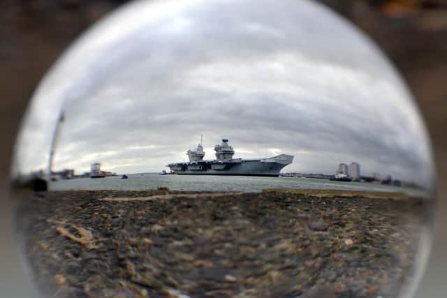 HMS Queen Elizabeth sailing back into Portsmouth