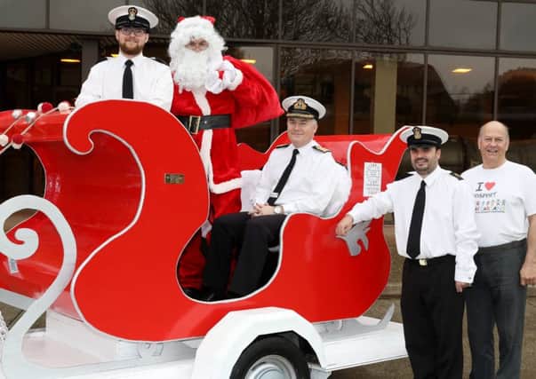 From left: PO Adam Hilton,  Father Christmas, Captain Peter Towell, CPO Chris 'Paddy' Gilkes and Malcolm Dent