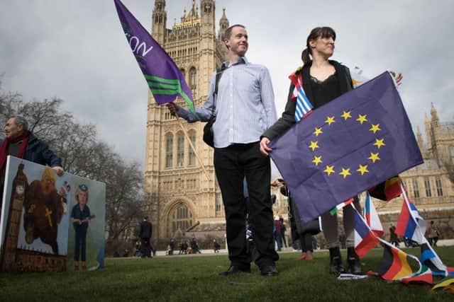 European workers including nurses, social workers and teaching assistants protest outside the Houses of Parliament in London before lobbying MPs over their right to remain in the UK. Picture: Stefan Rousseau/PA Wire