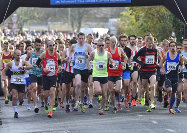 The start of the Gosport Half Marathon race as James Baker, wearing 85, hits the front early on. Picture: Neil Marshall