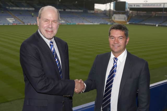 Michael Eisner, left, with Pompey chief executive Mark Catlin. Picture: Habibur Rahman