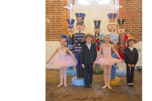 The Amy Hackett School of Dance, Southsea at the dockyard with the nutcrackers. From left, Marie Mitchell, eight, Evan Ashdown, eight, Evie Baldwin, seven, and Cosmo Thomson, seven Picture: Chris Stephens