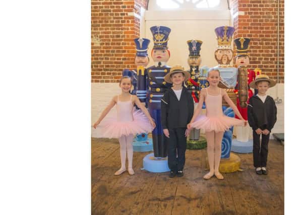 The Amy Hackett School of Dance, Southsea at the dockyard with the nutcrackers. From left, Marie Mitchell, eight, Evan Ashdown, eight, Evie Baldwin, seven, and Cosmo Thomson, seven Picture: Chris Stephens